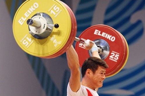 Thạch Kim Tuấn thi đấu tại Giải vô địch thế giới 2014 - Ảnh: IWF