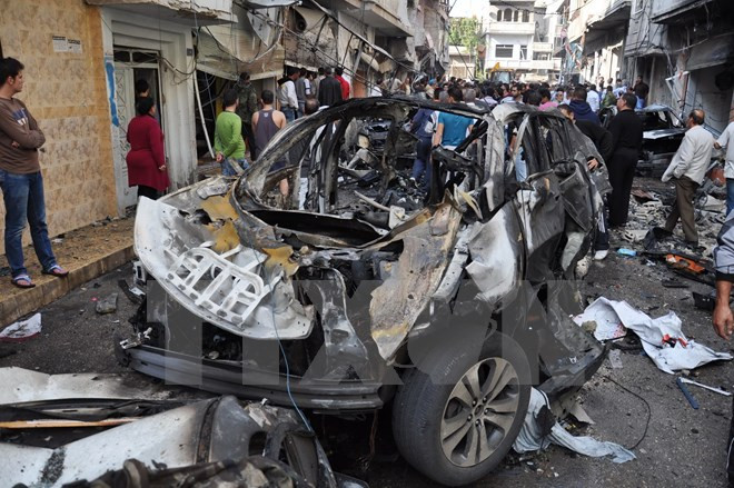 Hiện trường một vụ đánh bom ở Syria. Nguồn: AFP/TTXVN
