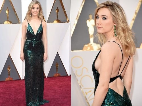 Saoirse Ronan theo đuổi mốt đính sequin bằng một thiết kế xẻ lưng gợi cảm của Calvin Klein. Hoa tai màu lục bảo cùng tông váy khiến người đẹp thêm phần lộng lẫy.