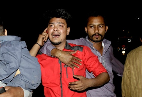 A man mourns the death of his relative in a bomb blast, at a local hospital in Lahore, Pakistan, March, 27, 2016.