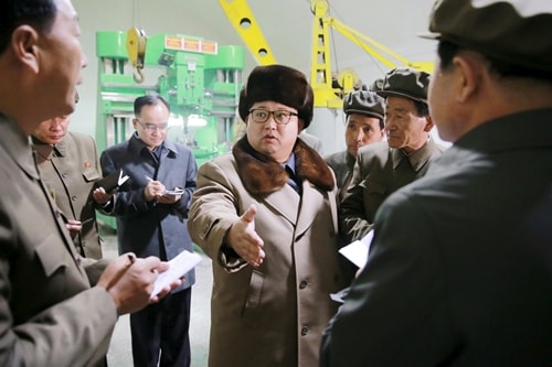 North Korean leader Kim Jong Un (C) speaks during a visit to the Sinhung Machine Plant in this undated photo released by North Korea's Korean Central News Agency (KCNA) in Pyongyang April 1,