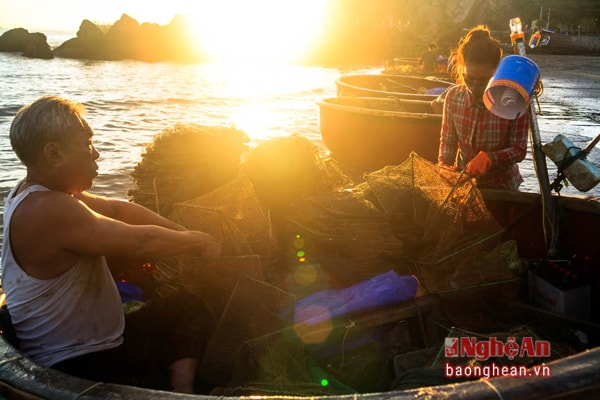 Father and daughter collect nets.