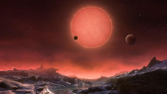 Quang cảnh trên 1 trong 3 hành tinh xoay quanh ngôi sao lùn Trappist-1 được Đài thiên văn Nam châu Âu phác họa lại. Ảnh AP