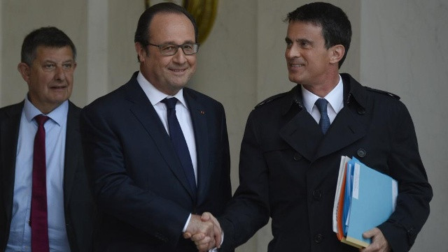 Tổng thống Francois Hollande và Thủ tướng Manuel Valls sau khi công bố quyết định của Chính phủ. Ảnh:AFP.