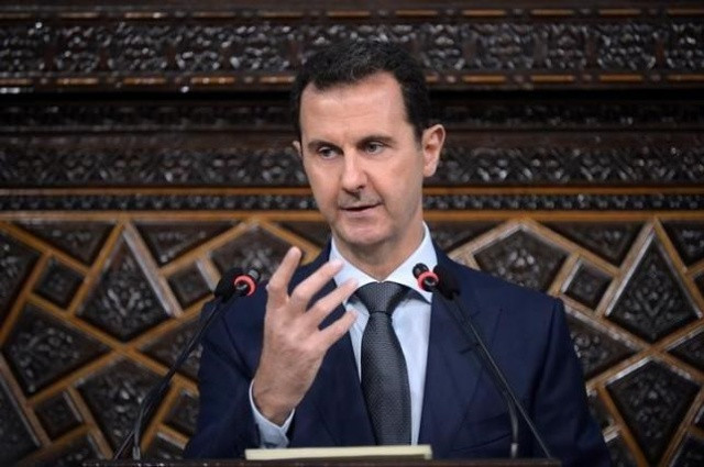 Tổng thống Syria Bashar al-Assad  đang ở vị thế mạnh hơn so với năm trước do được Nga hậu thuẫn chống lại các phe đối lập. Ảnh: AP