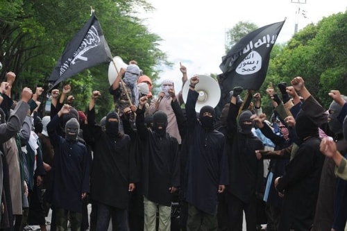Indonesian Muslim hard-liners waved an Islamic State flag during rally against Syrias President Bashar al-Assad in central Java island in 2013
