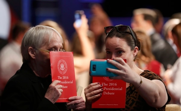 Two attendees in the audience shoot a selfie ahead of the U.S. Vice Presidential Debate at Longwood University in Farmville