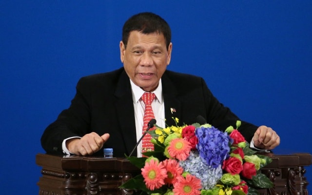 Ông Duterte phát biểu tại diễn đàn kinh doanh ở Bắc Kinh hôm 20/10. Ảnh: AFP.
