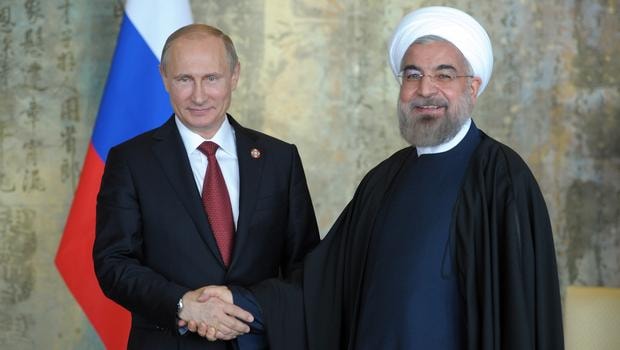 Tổng thống Nga Vladimir Putin và người đồng cấp Iran Hassan Rauhani (phải) cũng đứng về một phía tại Syria. Nguồn: AFP