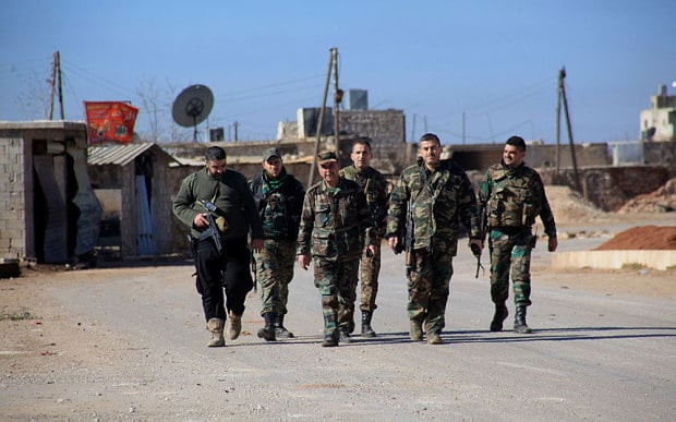 Lực lượng chính phủ Syria tại ngôi làng Tal Jabin, phía Bắc Aleppo. Ảnh: AFP