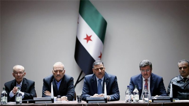  Phái đoàn của lực lượng đối lập Syria tham gia vòng hòa đàm Syria tại Geneva (Thụy Sĩ) hồi tháng 4 năm ngoái. Ảnh: AP