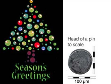 Thiệp Giáng sinh nhỏ nhất thế giới được chế tạo bằng công nghệ nano và có độ rộng gấp đôi một sợi tóc người. Ảnh: BBC.
