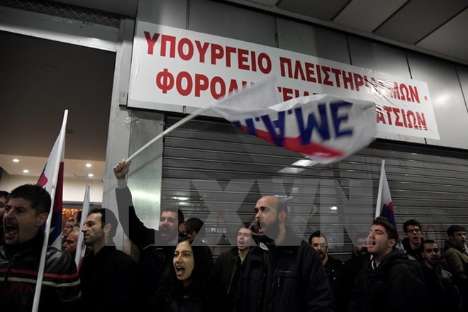 Người dân biểu tình phản đối cải cách tại Athens, Hy Lạp ngày 11/1. Nguồn: AFP/TTXVN