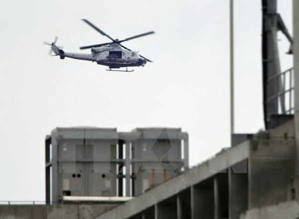 Máy bay AH-1 của Mỹ bay qua Nago thuộc đảo Okinawa, Nhật Bản ngày 9/1.Nguồn: Kyodo/TTXVN