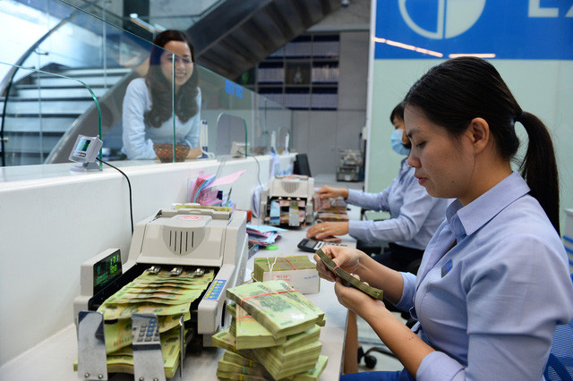 Ngân hàng Nhà nước siết chặt việc giải ngân bằng tiền mặt - Ảnh: Thuận Thắng