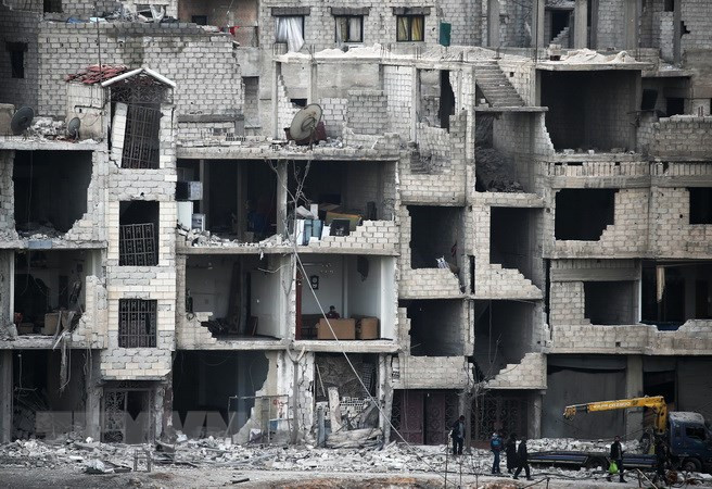 Cảnh đổ nát do xung đột tại Đông Ghouta, Syria ngày 25/2. Nguồn: AFP/TTXVN