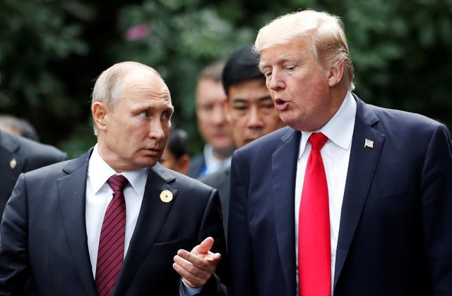 Tổng thống Nga Vladimir Putin (trái) và người đồng cấp Mỹ Vladimir Putin. Ảnh: Reuters