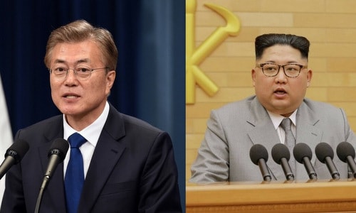 Tổng thống Hàn Quốc Moon Jae-in và lãnh đạo Triều Tiên Kim Jong-un. Ảnh: Reuters. 