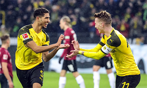 Dortmund đang thăng hoa với sự pha trộn hài hòa giữa lớp cựu binh giàu kinh nghiệm như Reus (phải) với thế hệ trẻ của những Hakimi (trái), Sancho...