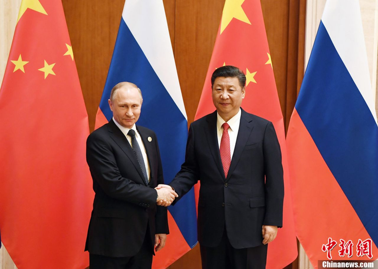 Tổng thống Nga Vladimir Putin và Chủ tịch Trung Quốc Tập Cận Bình. Ảnh: Getty