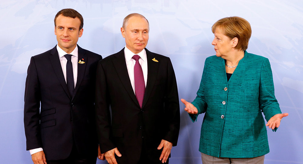 Tổng thống Nga Vladimir Putin, Tổng thống Pháp Emmanuel Macron và Thủ tướng Đức Angela Merkel. Ảnh: Reuters 