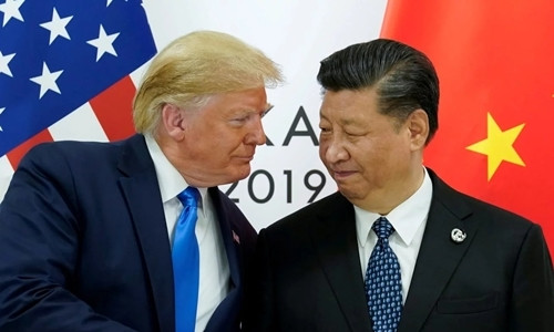 Tổng thống Mỹ Trump (trái) và Chủ tịch Trung Quốc Tập Cận Bình tại Osaka hồi tháng 6. Ảnh: AFP.