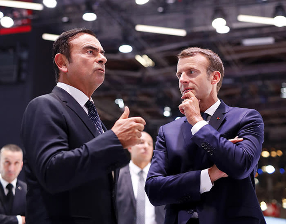 Carlos Ghosn và Tổng thống Pháp Emmanuel Macron trong cuộc triển lãm ô tô tại Paris tháng 10/2018 - một tháng trước khi bị bắt. Ảnh: Getty