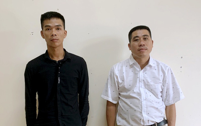 Nguyễn Văn An (góc phải) và Đào Nhật Vũ tại cơ quan điều tra. Ảnh: Đức Hùng