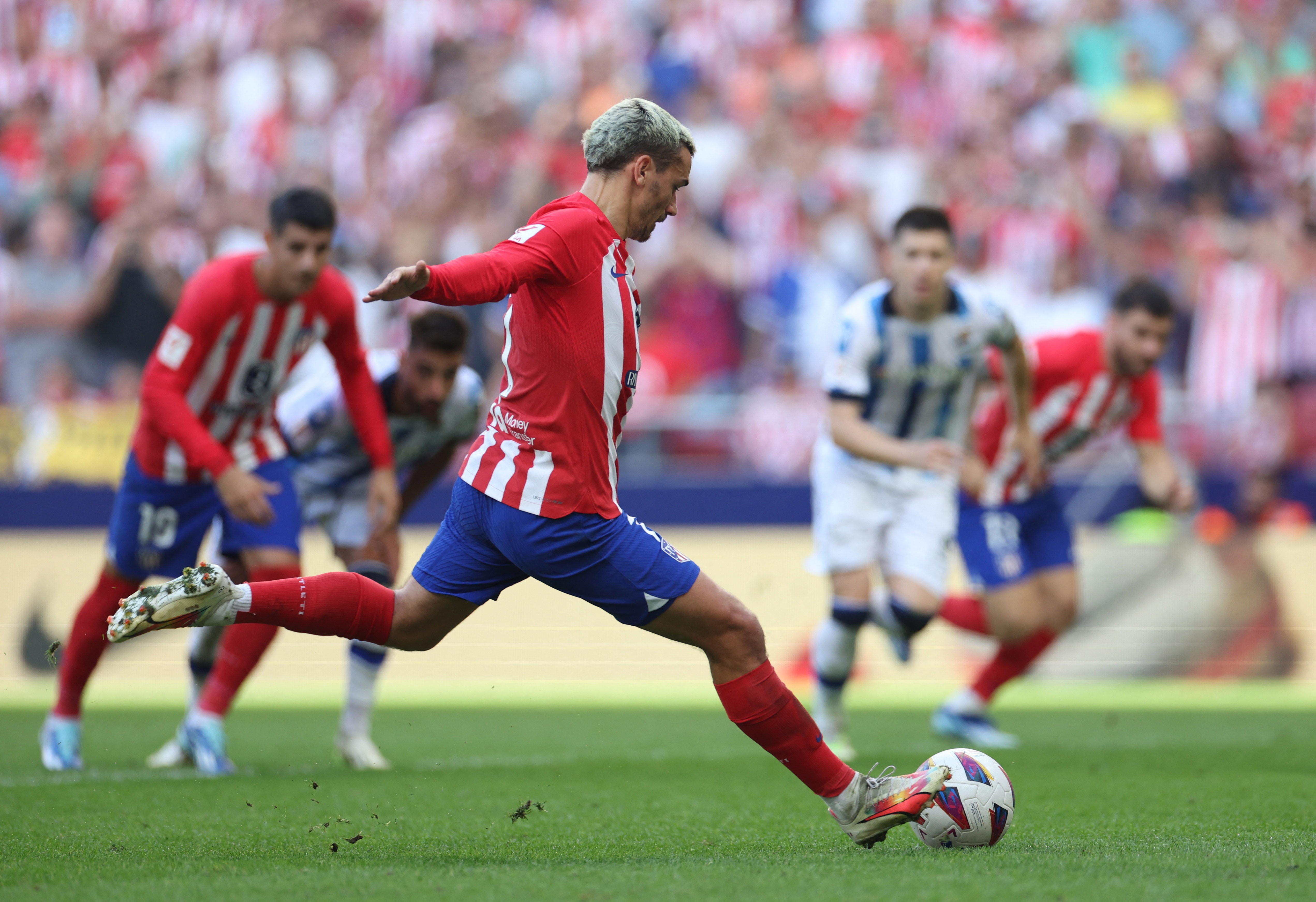 Griezmann's late penalty earns Atletico 2-1 win over Sociedad | Reuters