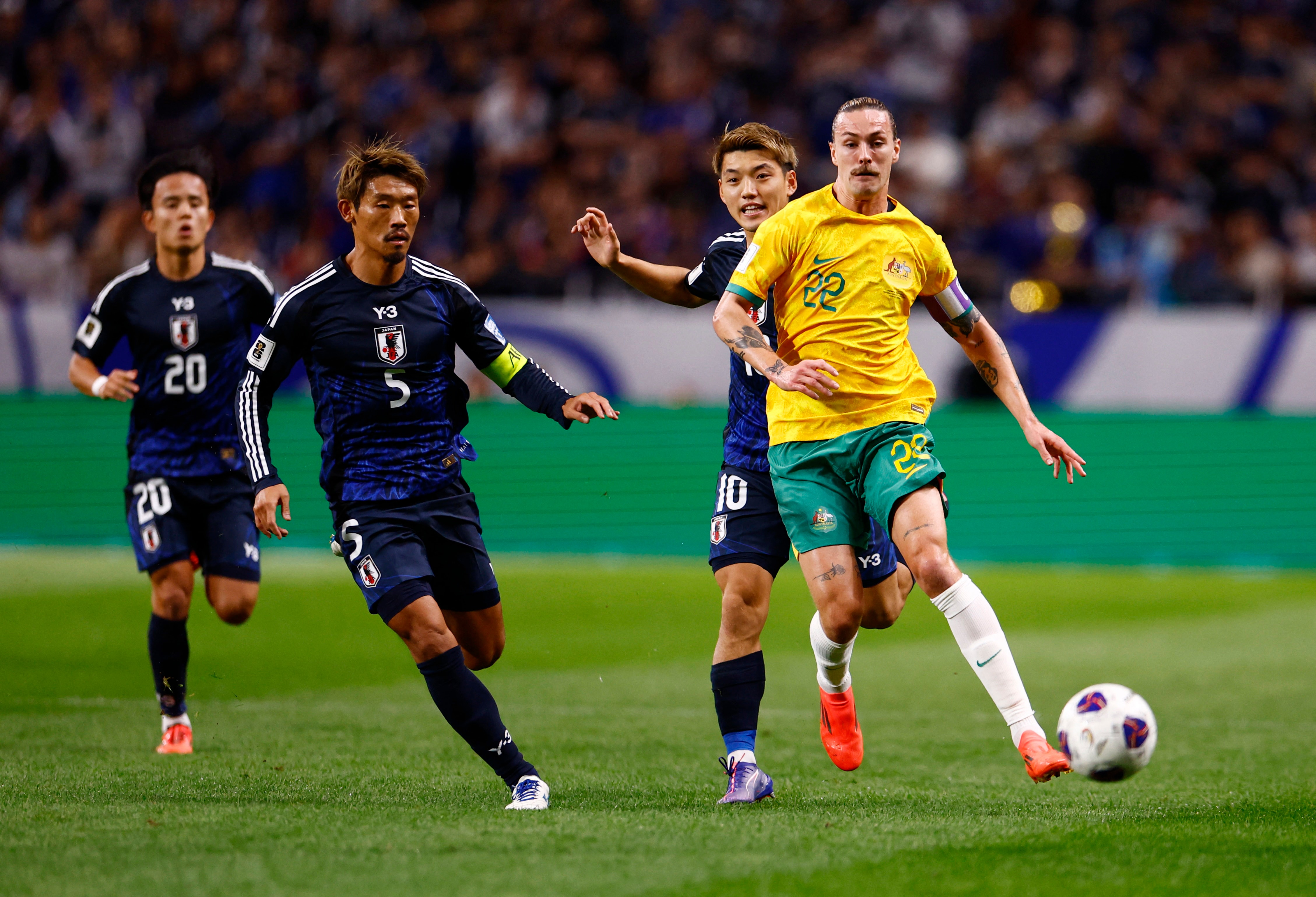 Australia end Japan's winning run as Saudis held by Bahrain | Reuters