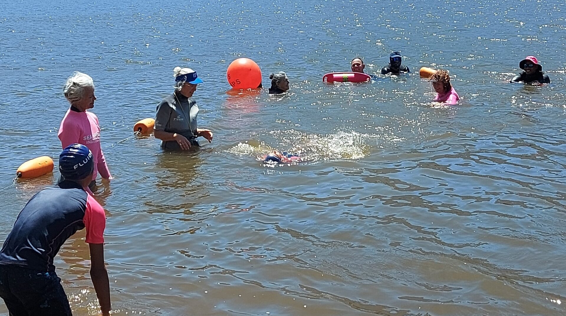 Eight Children Take the Plunge in Survival Swimming Exercise