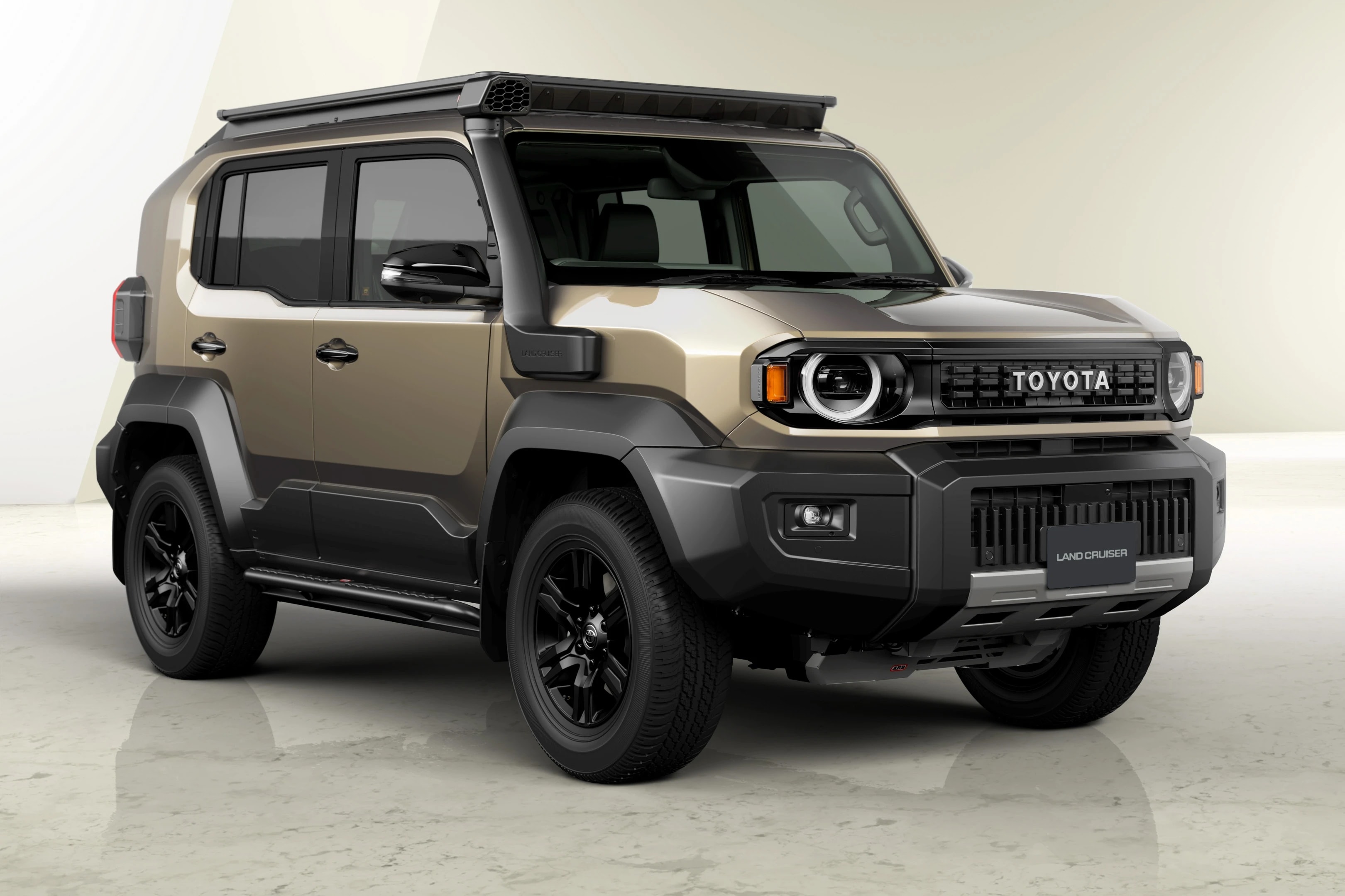 Chi tiết phần đầu xe Toyota Land Cruiser FJ với lưới tản nhiệt có dòng chữ TOYOTA và đèn pha tròn đặc trưng.