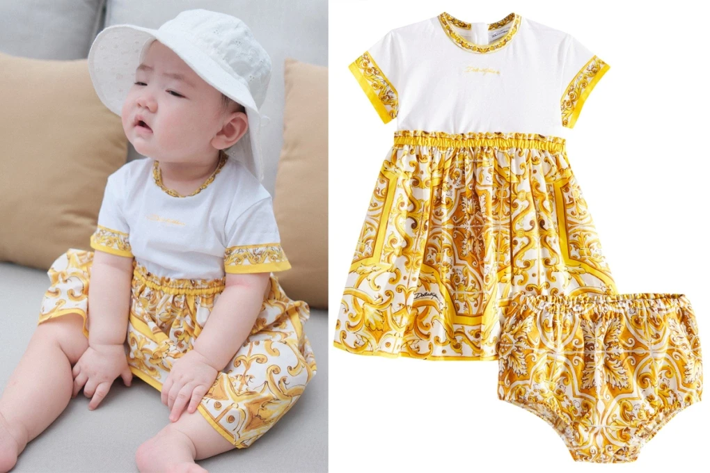 Con gái Tú Anh mặc bộ váy có giá trên dưới 15 triệu đồng.