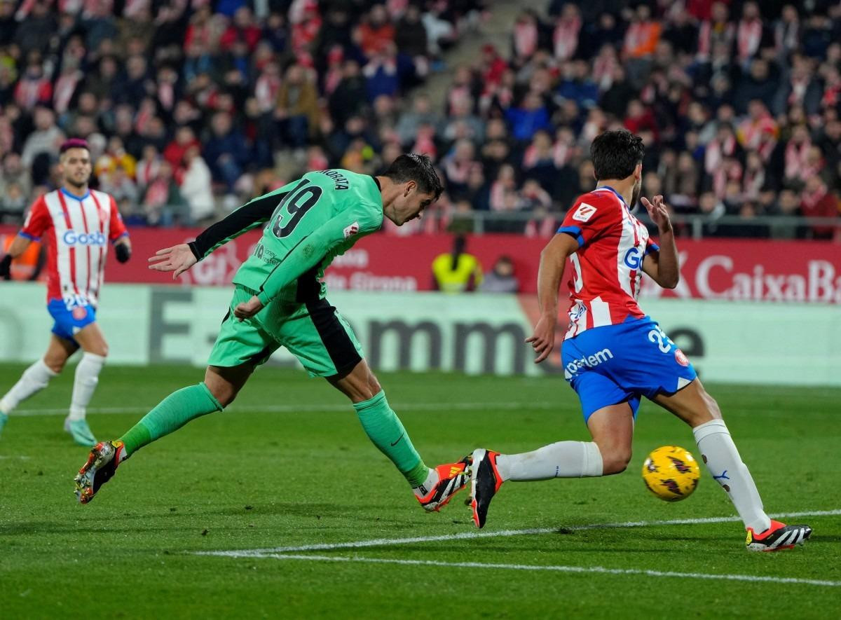Girona get late win over Atletico to keep pace with leaders Real
