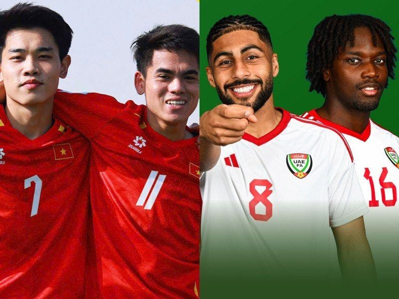 Cầu thủ U23 Việt Nam tranh chấp bóng với U23 UAE