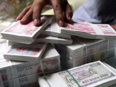 Đổi tiền lẻ kiếm lời có thể bị phạt 40 triệu đồng