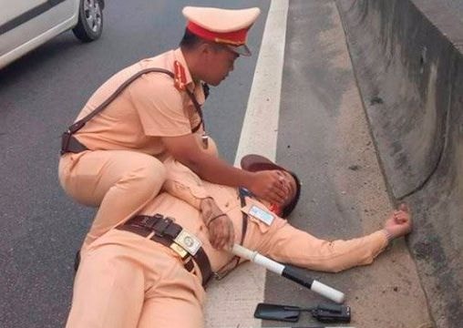 Tạm giữ tài xế container hất văng CSGT xuống đường