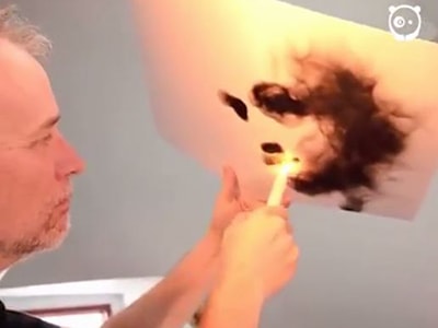 Dùng nến, bật lửa để vẽ tranh trên giấy