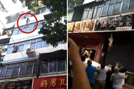 Hai đứa trẻ thoát chết nhờ mẹ ném qua cửa sổ căn hộ bốc cháy