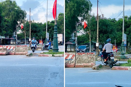 Người dân bất chấp nguy hiểm vượt rào chắn trên Đại lộ Lê Nin (TP. Vinh)